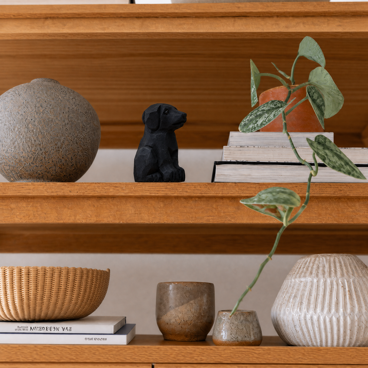 Labrador Retriever Black hand-carved wooden figurine by Selsela, styled in a home setting