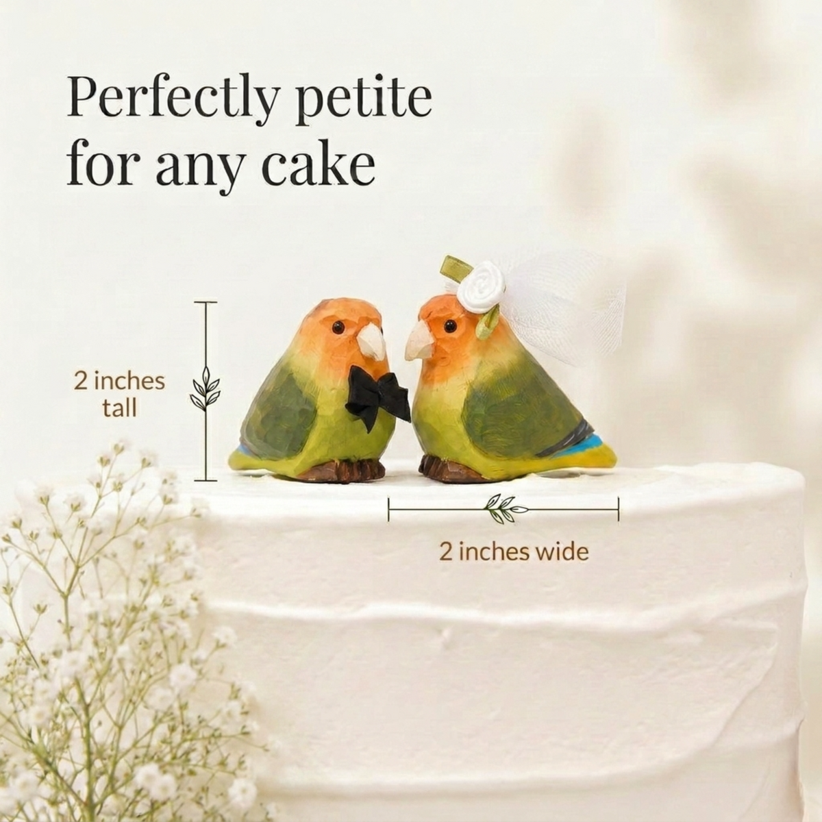 Lovebirds hand-carved wooden cake topper by Selsela, bride and groom pair on a wedding cake