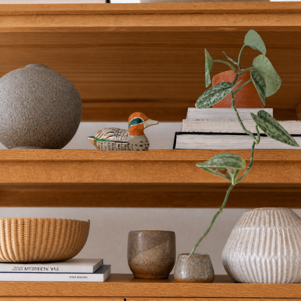 Eurasian Teal hand-carved wooden figurine by Selsela, styled in a home setting