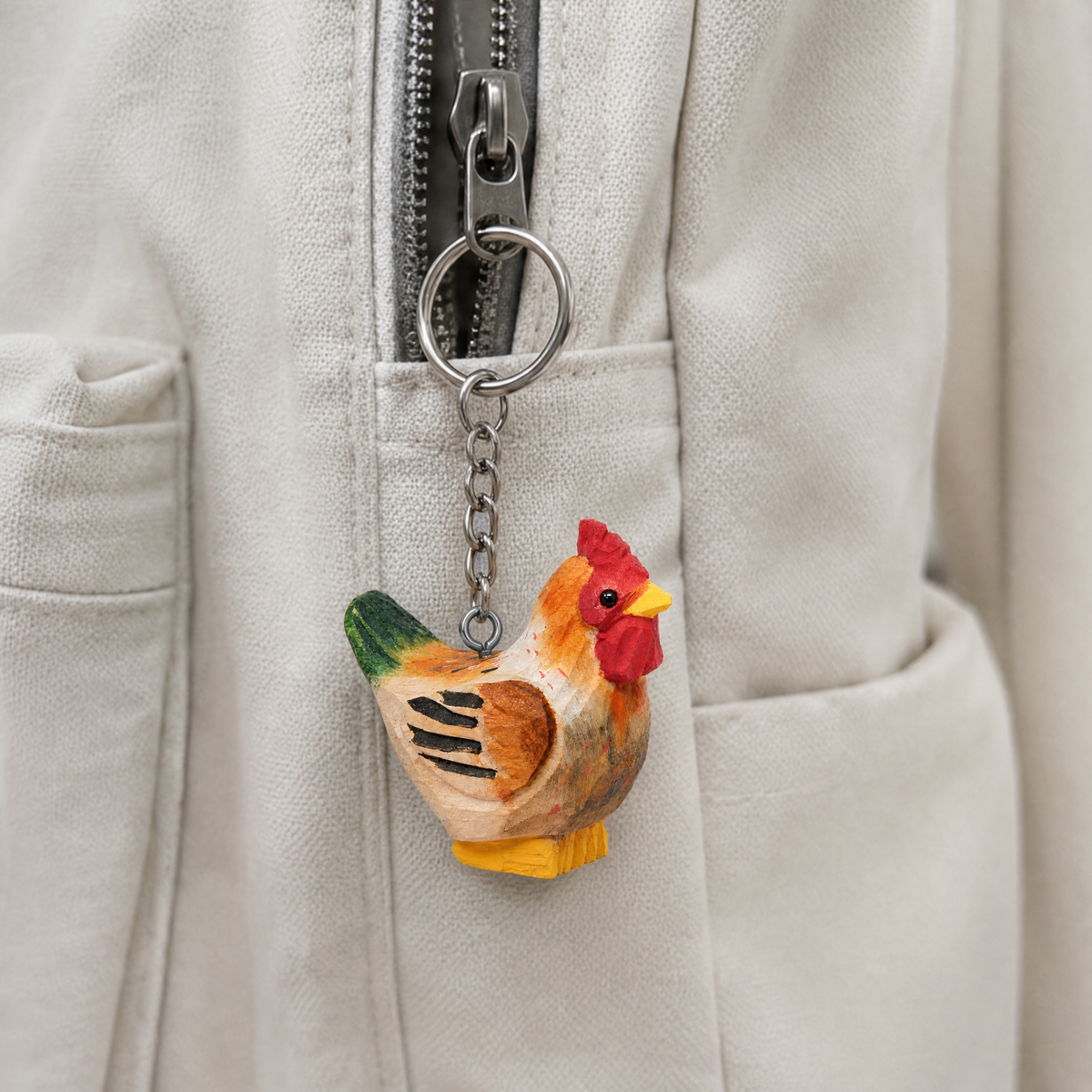Brown Hen hand-carved wooden keychain by Selsela, in a styled scene
