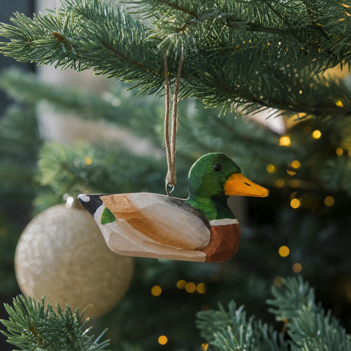 Mallard Duck Male hand-carved wooden ornament by Selsela, hanging on a Christmas tree