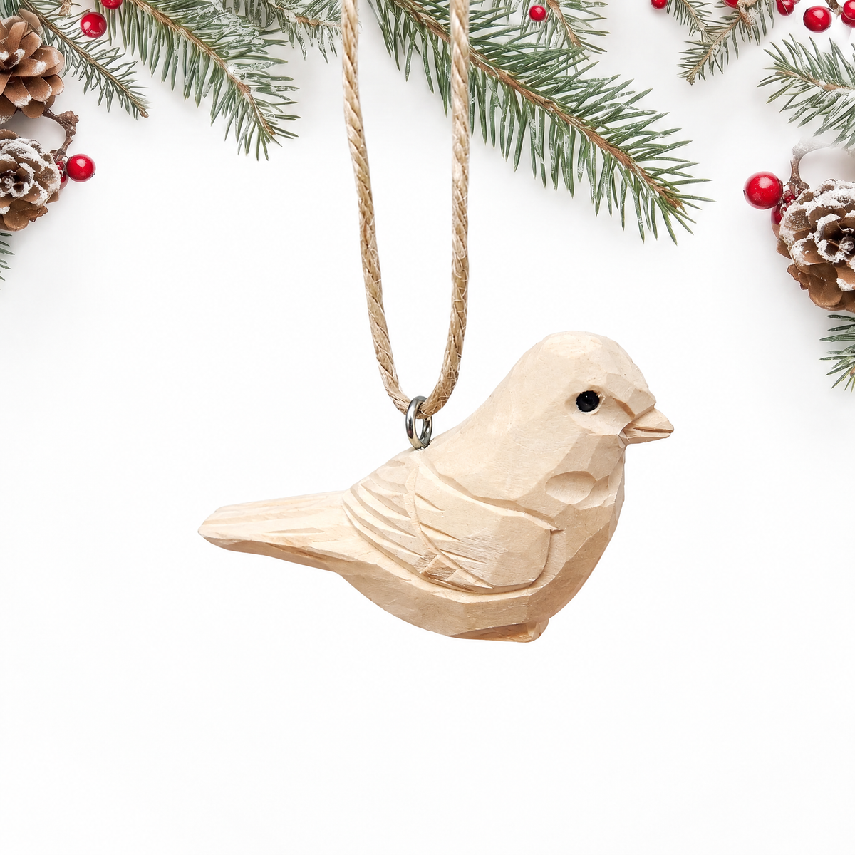 Unpainted Bird hand-carved wooden ornament by Selsela, on a plain background