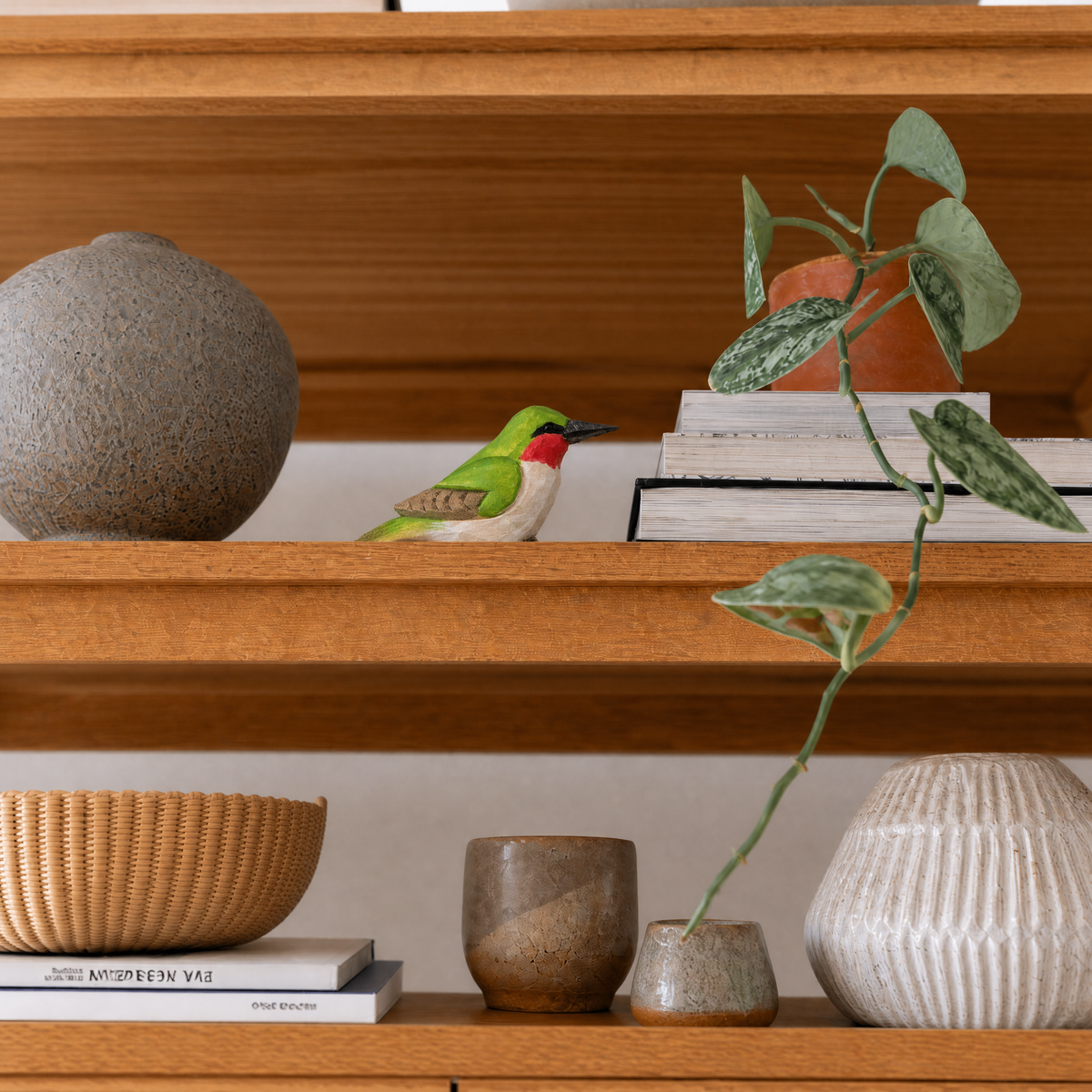 Hummingbird hand-carved wooden figurine by Selsela, styled in a home setting