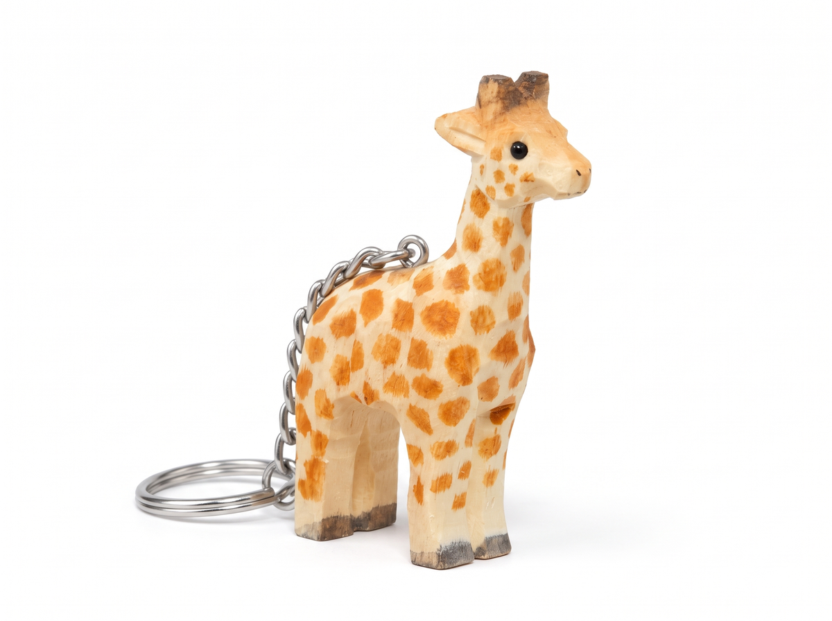 Giraffe hand-carved wooden keychain by Selsela, on a plain background