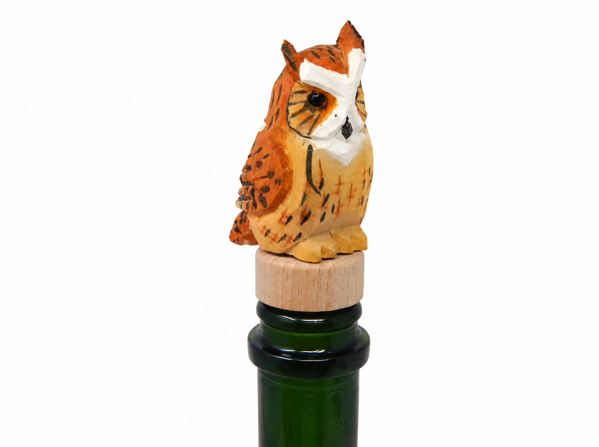 Great Horned Owl hand-carved wooden wine stopper by Selsela, on a plain background