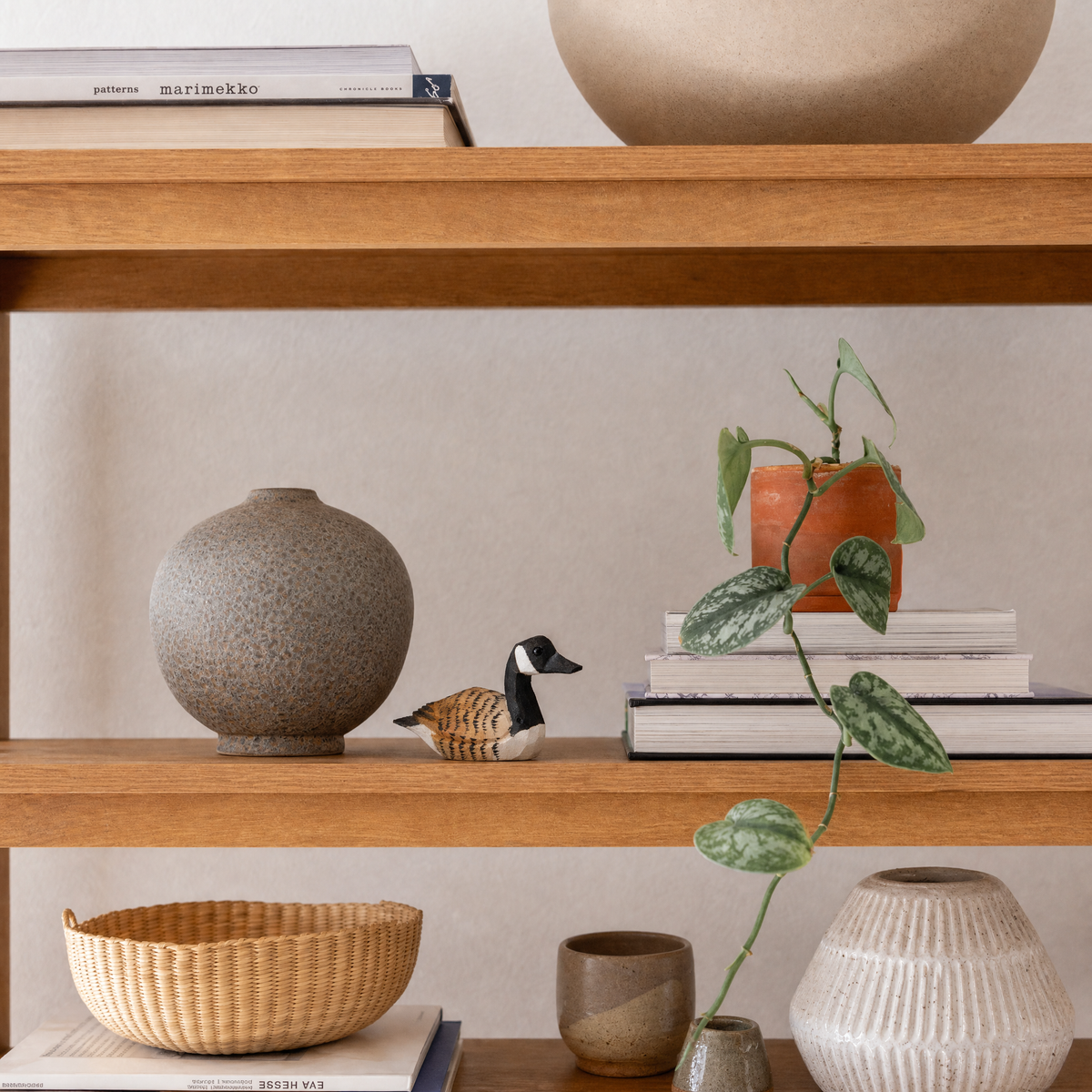 Canada Goose hand-carved wooden figurine by Selsela, styled in a home setting