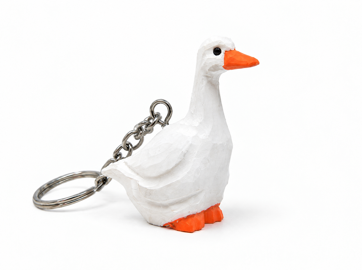 White Goose hand-carved wooden keychain by Selsela, on a plain background