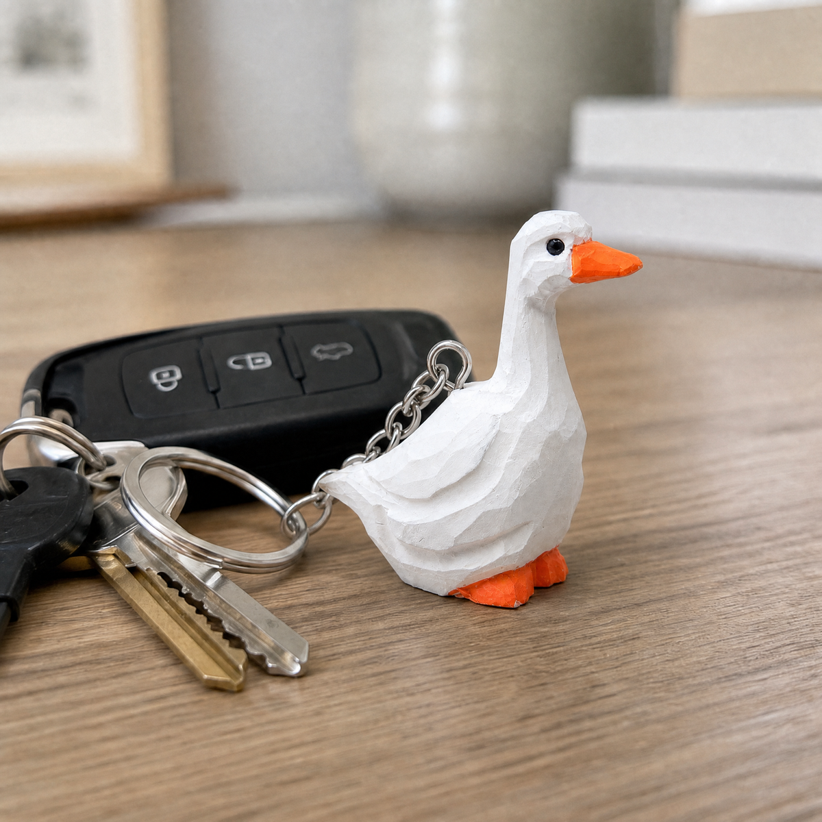 White Goose hand-carved wooden keychain by Selsela, in a styled scene