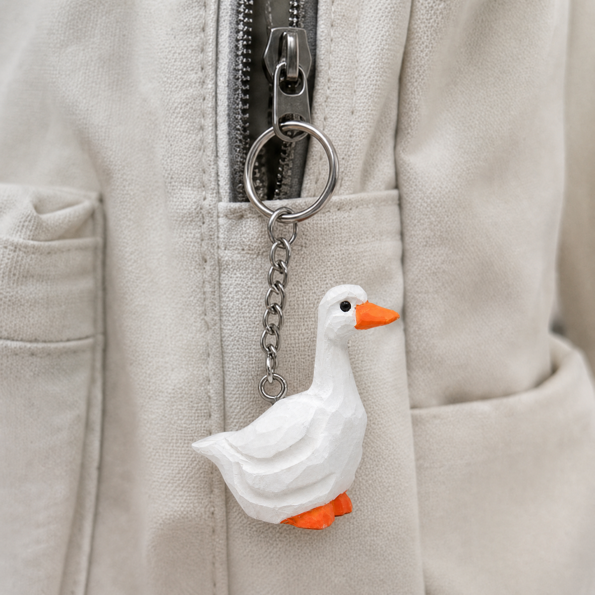 White Goose hand-carved wooden keychain by Selsela, in a styled scene