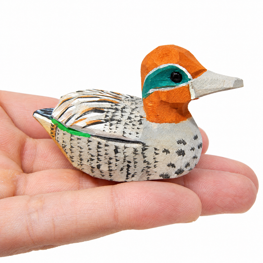Eurasian Teal hand-carved wooden figurine by Selsela, on a plain background