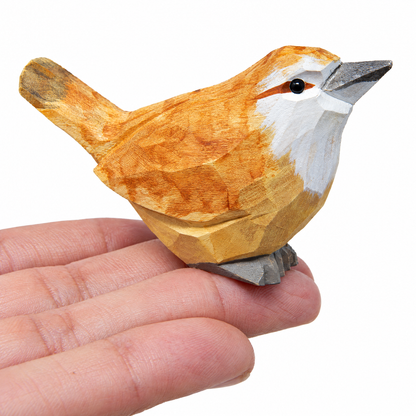 Carolina Wren hand-carved wooden figurine by Selsela, on a plain background