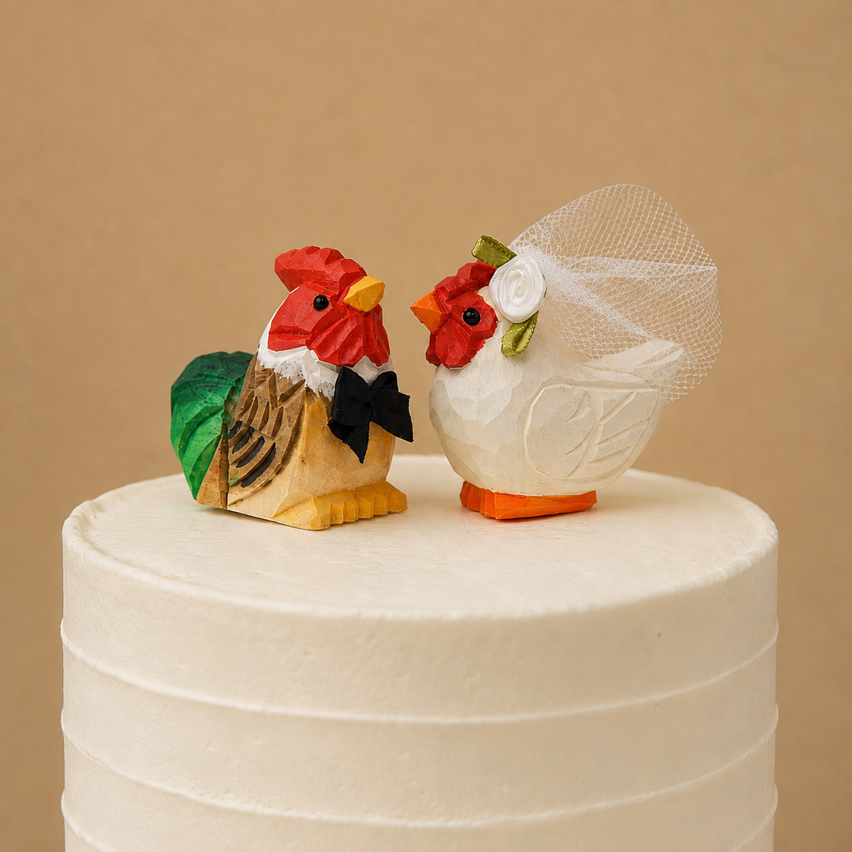 Rooster hand-carved wooden cake topper by Selsela, bride and groom pair on a wedding cake
