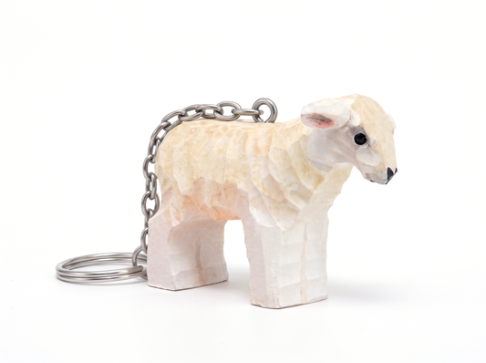 Sheep hand-carved wooden keychain by Selsela, on a plain background