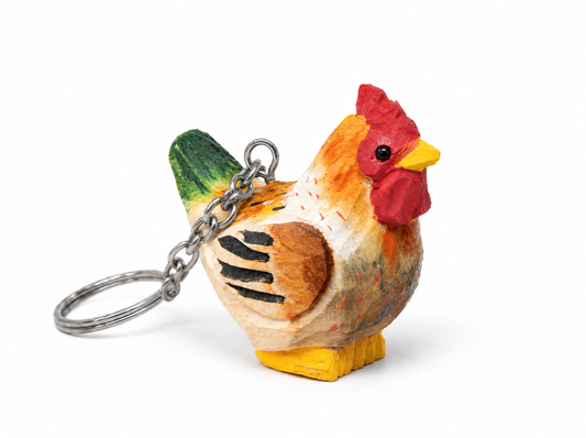 Brown Hen hand-carved wooden keychain by Selsela, on a plain background