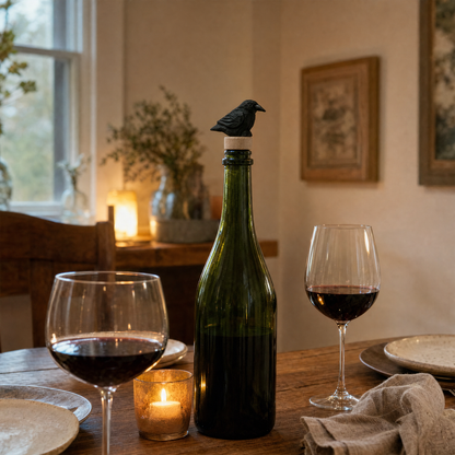 Raven hand-carved wooden wine stopper by Selsela, in a styled scene