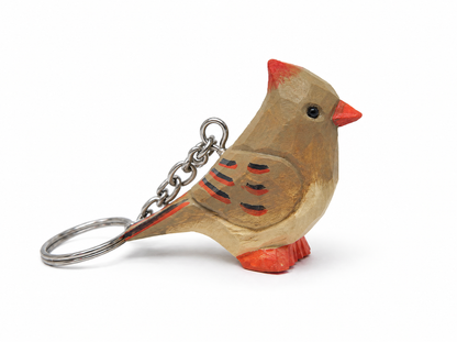 Cardinal Female hand-carved wooden keychain by Selsela, on a plain background