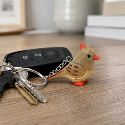 Cardinal Female hand-carved wooden keychain by Selsela, in a styled scene