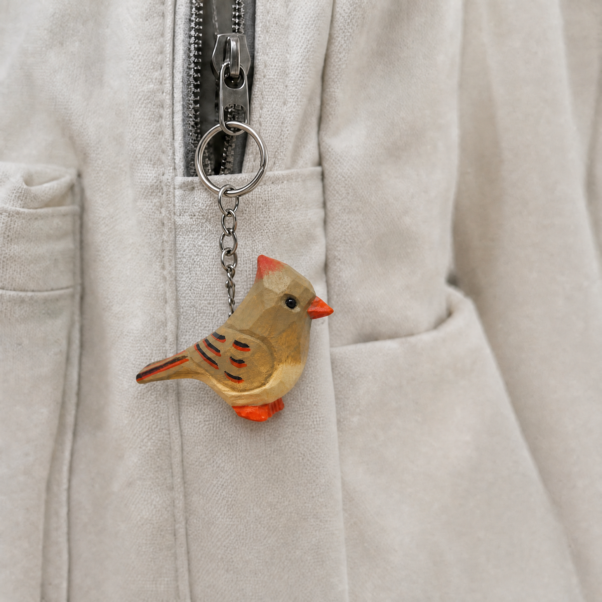 Cardinal Female hand-carved wooden keychain by Selsela, in a styled scene