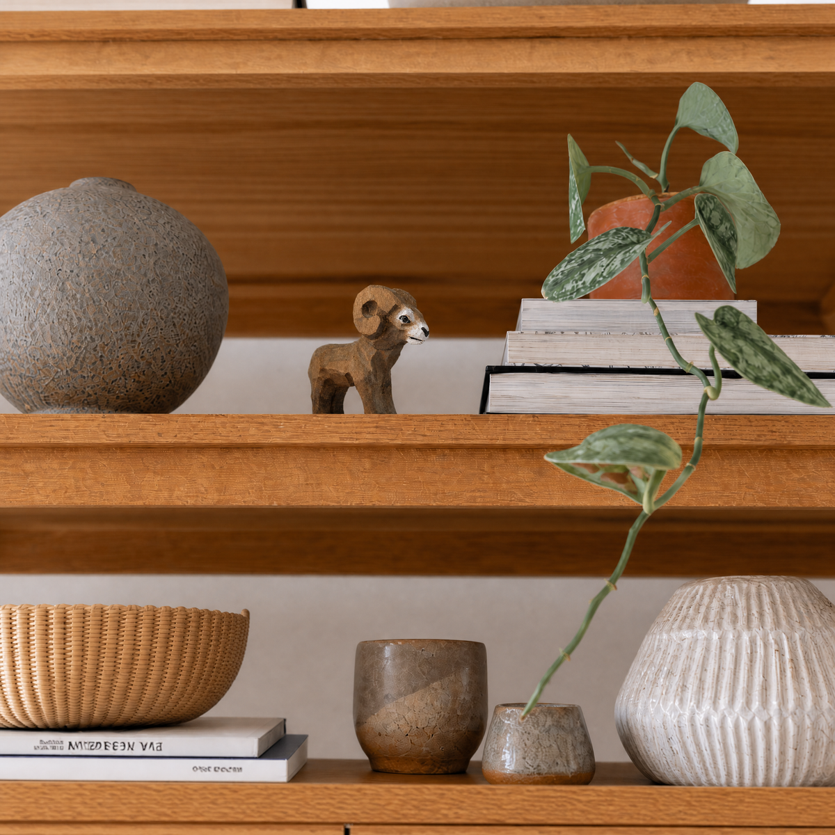 Ram hand-carved wooden figurine by Selsela, styled in a home setting