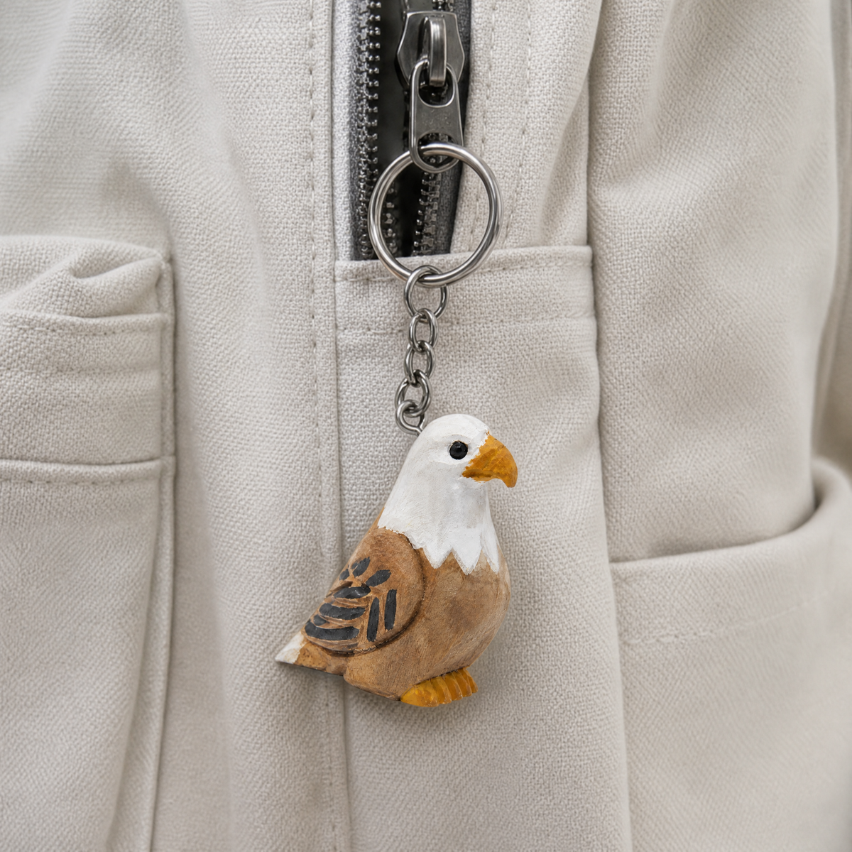 Bald Eagle hand-carved wooden keychain by Selsela, in a styled scene