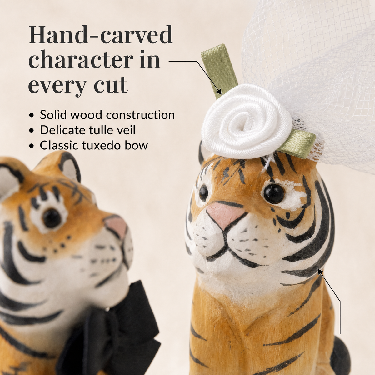Tiger hand-carved wooden cake topper by Selsela, bride and groom pair on a wedding cake