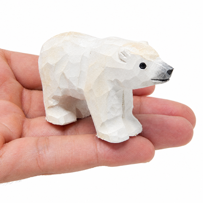 Polar Bear hand-carved wooden figurine by Selsela, on a plain background