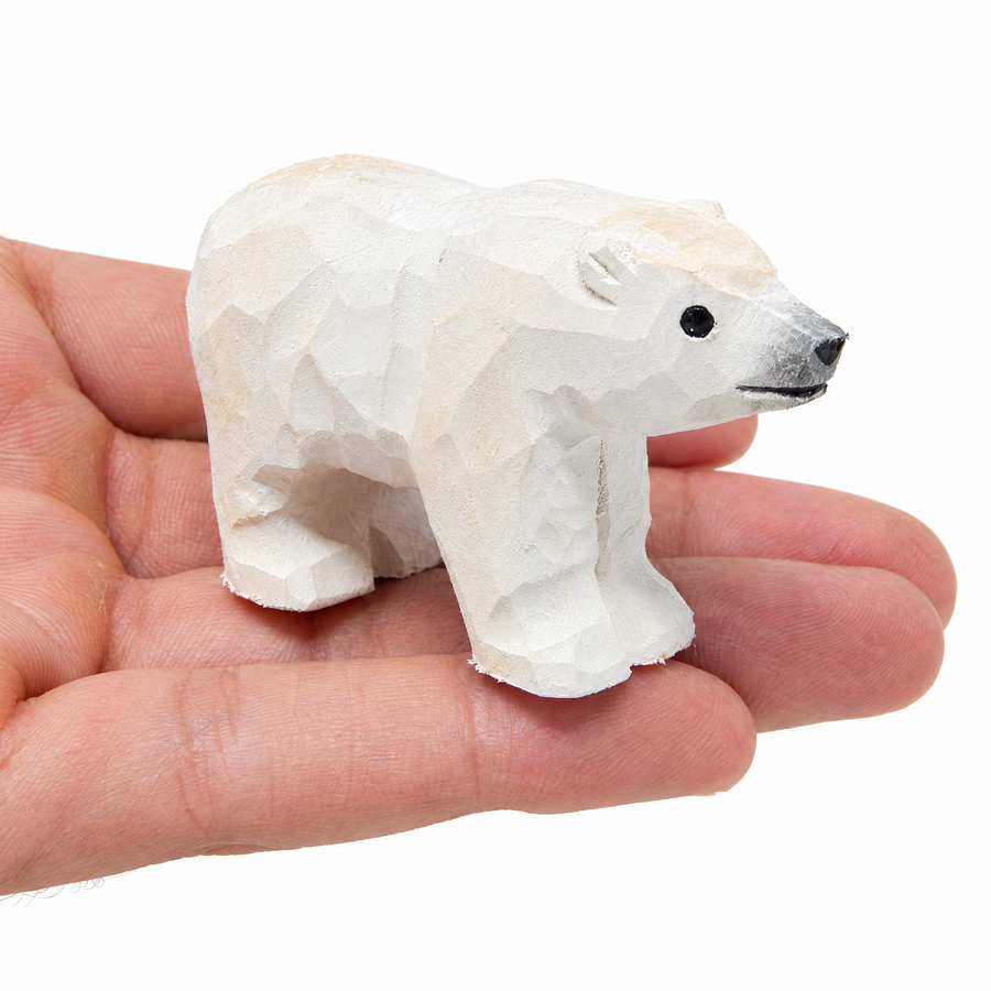 Polar Bear hand-carved wooden figurine by Selsela, on a plain background