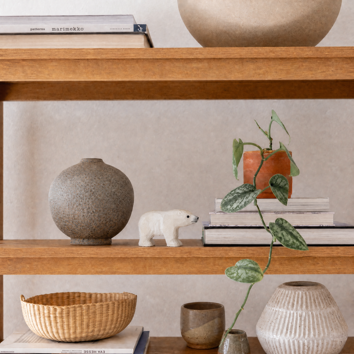 Polar Bear hand-carved wooden figurine by Selsela, styled in a home setting