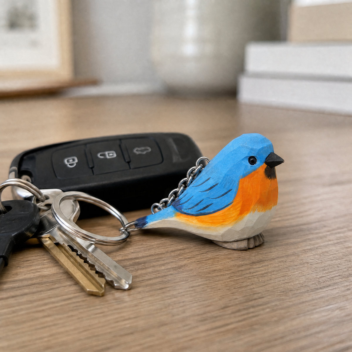 Eastern Bluebird hand-carved wooden keychain by Selsela, in a styled scene