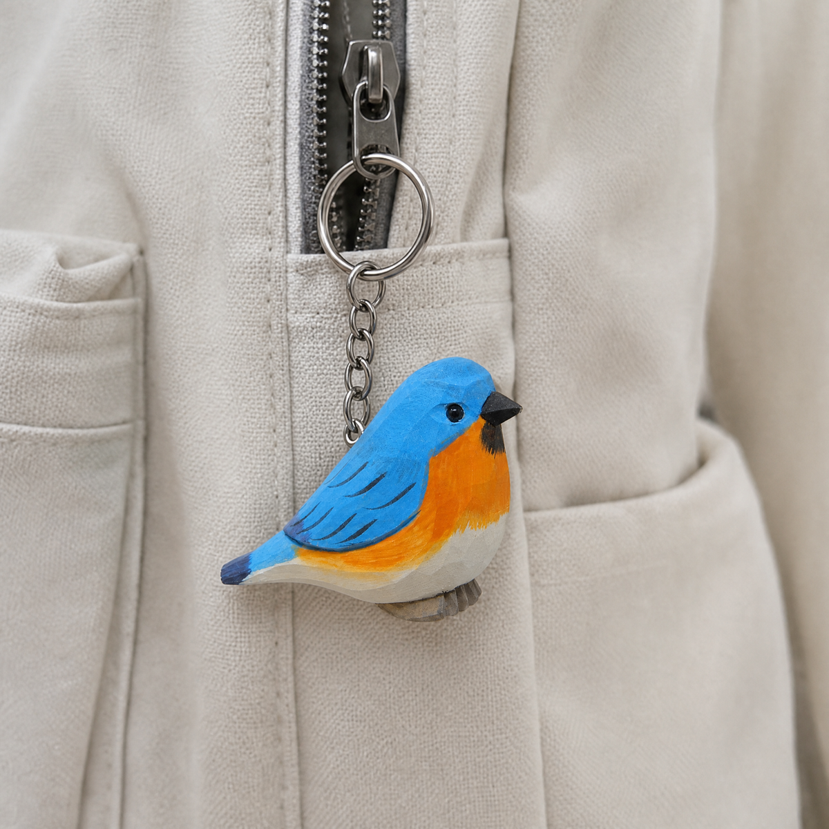 Eastern Bluebird hand-carved wooden keychain by Selsela, in a styled scene