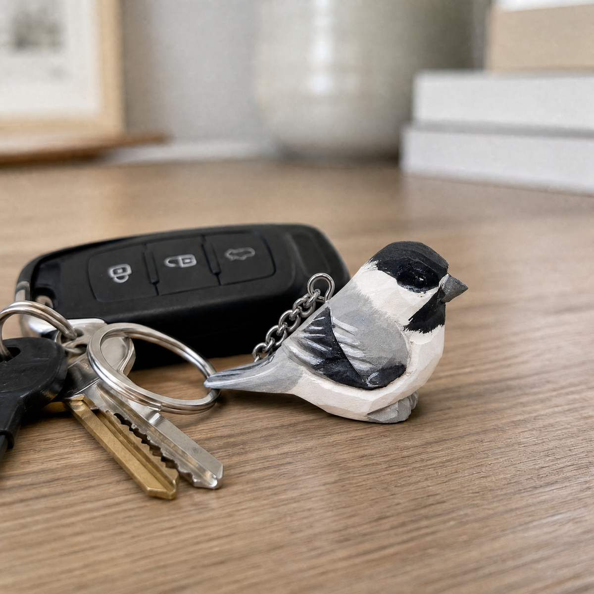 Chickadee hand-carved wooden keychain by Selsela, in a styled scene