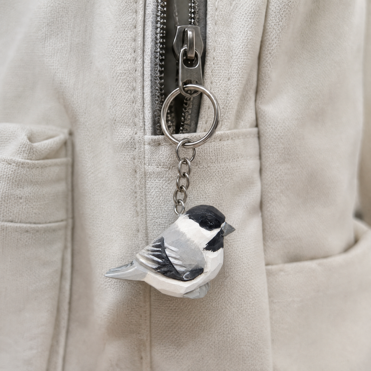 Chickadee hand-carved wooden keychain by Selsela, in a styled scene