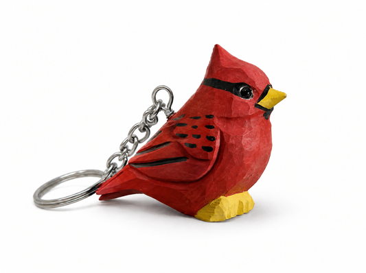 Cardinal Male hand-carved wooden keychain by Selsela, on a plain background