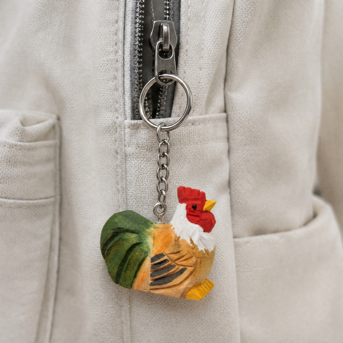 Rooster hand-carved wooden keychain by Selsela, in a styled scene