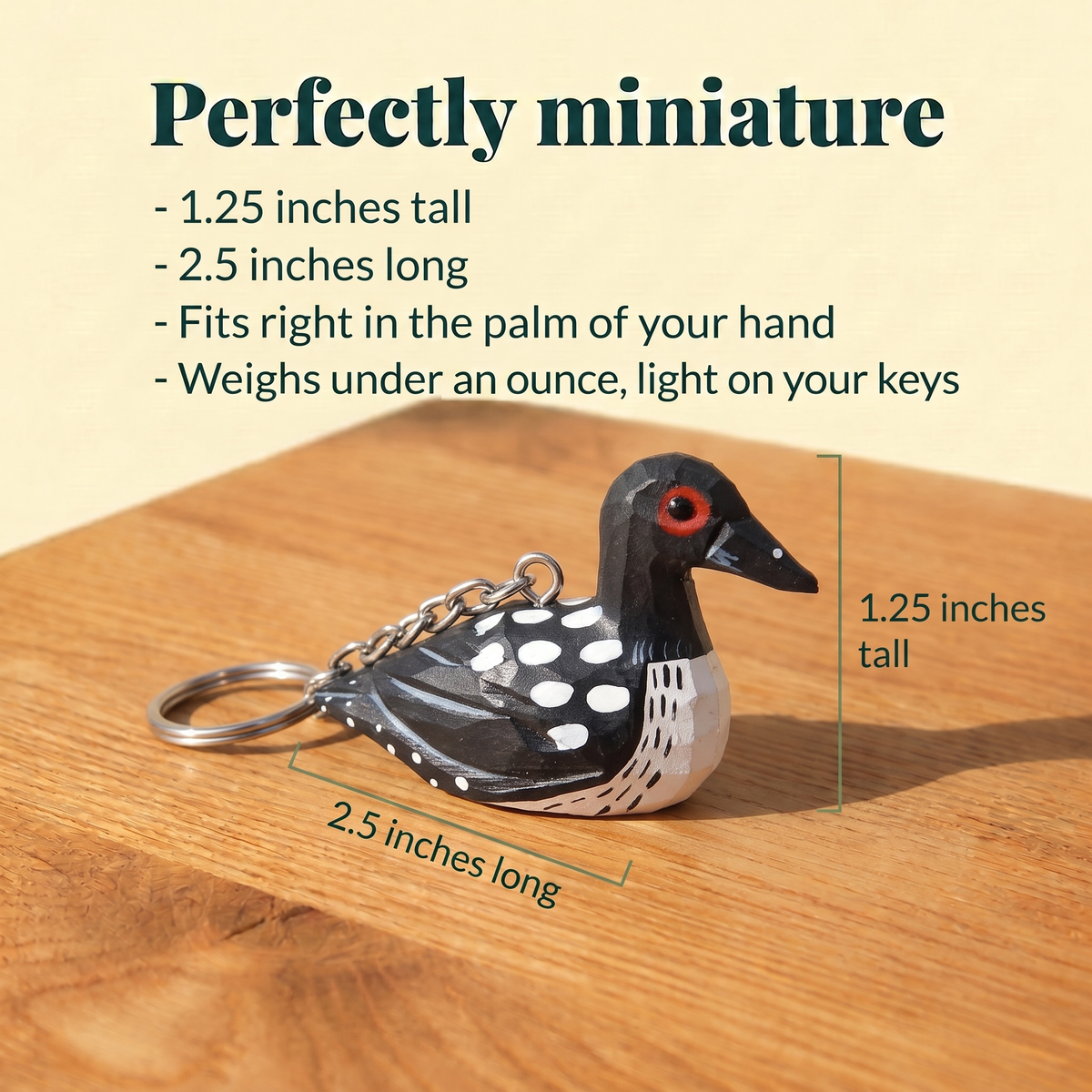 Common Loon hand-carved wooden keychain by Selsela, with size measurements