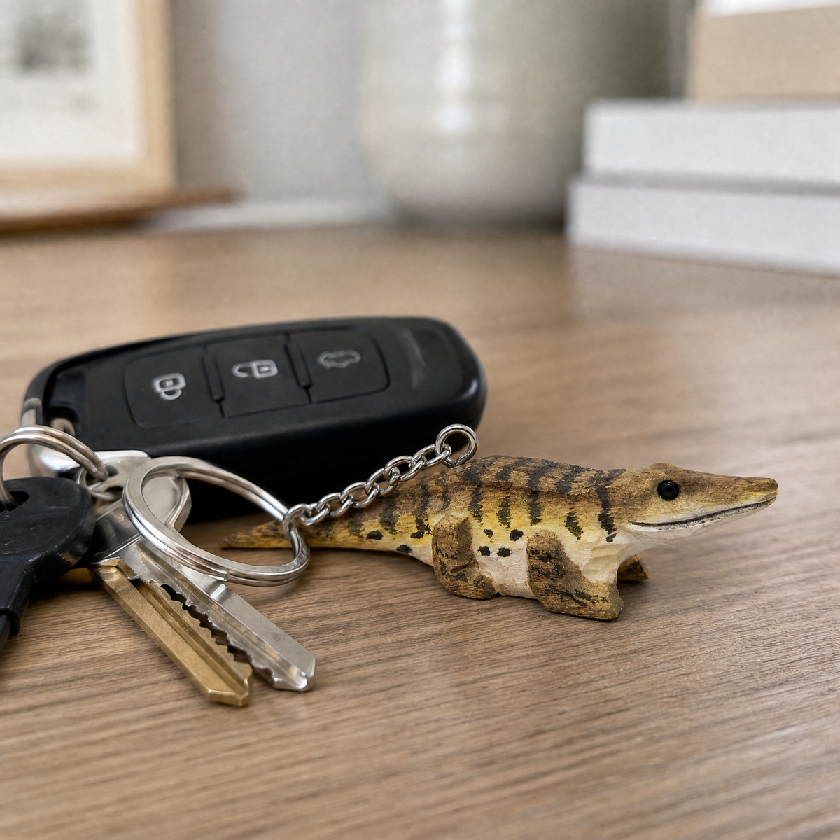 Crocodile hand-carved wooden keychain by Selsela, in a styled scene