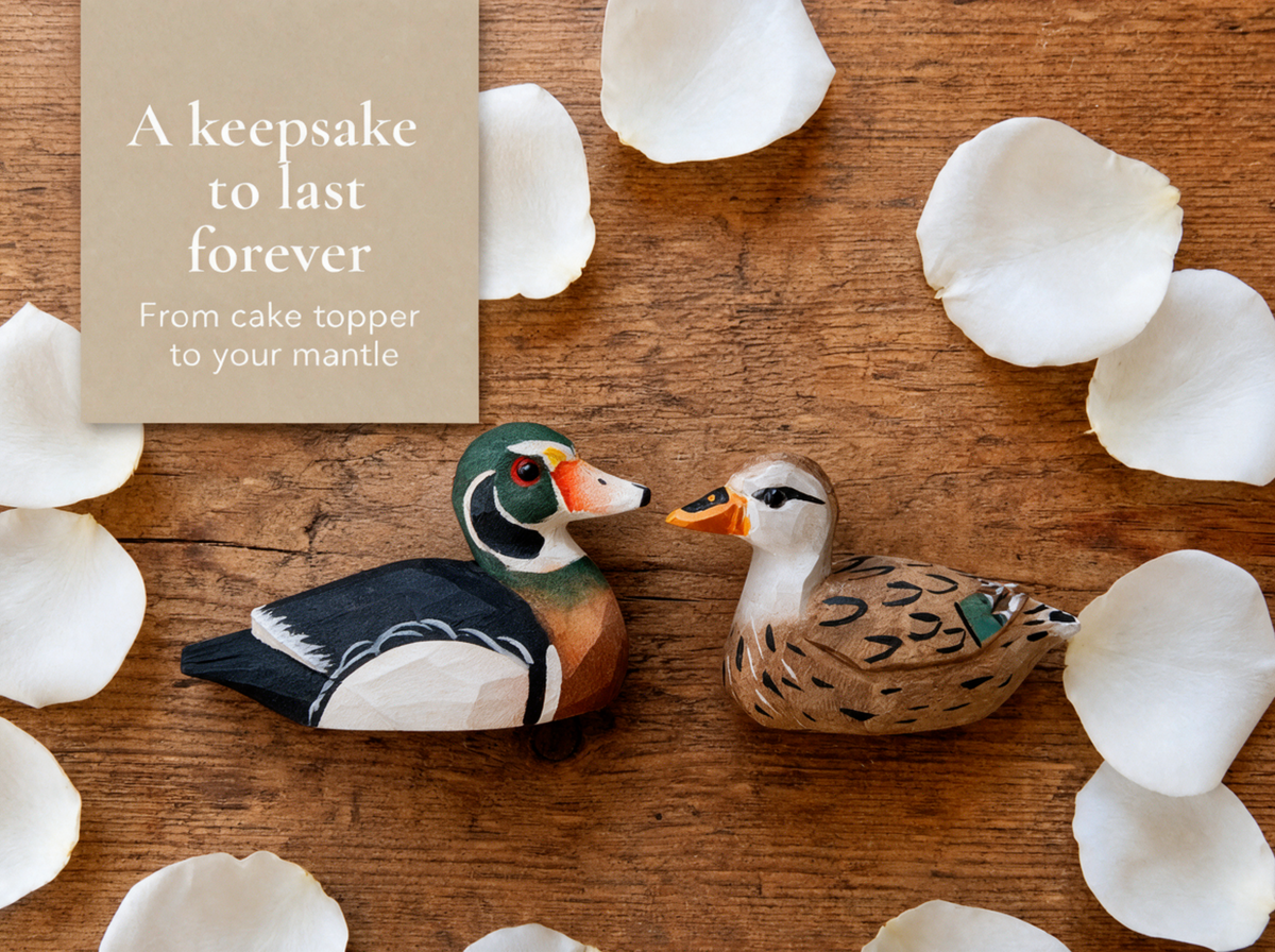 Wood Duck hand-carved wooden cake topper by Selsela, bride and groom pair on a wedding cake