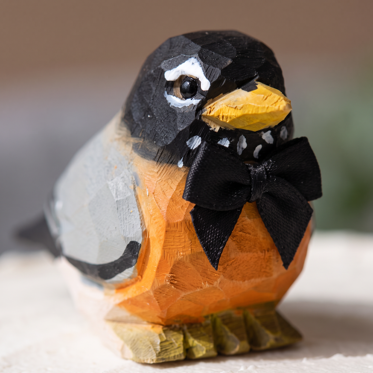 American Robin hand-carved wooden cake topper by Selsela, bride and groom pair on a wedding cake