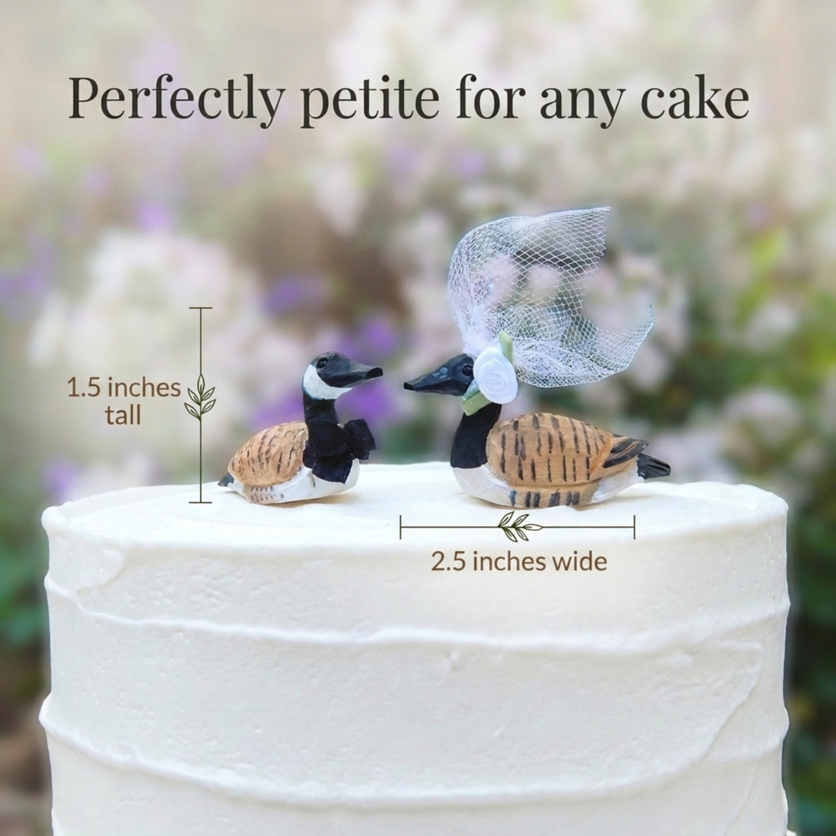 Canada Goose hand-carved wooden cake topper by Selsela, bride and groom pair on a wedding cake