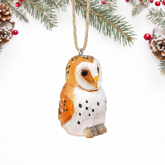 Barn Owl hand-carved wooden ornament by Selsela, on a plain background