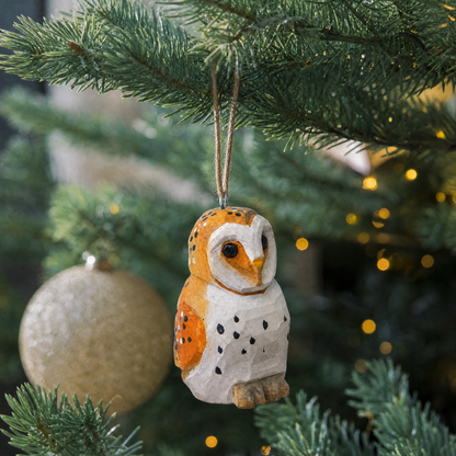 Barn Owl hand-carved wooden ornament by Selsela, hanging on a Christmas tree