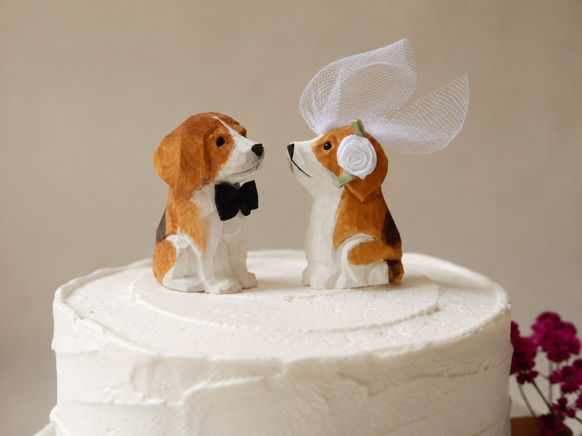 Beagle hand-carved wooden cake topper by Selsela, bride and groom pair on a wedding cake
