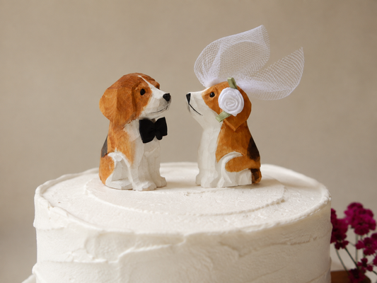 Beagle hand-carved wooden cake topper by Selsela, bride and groom pair on a wedding cake