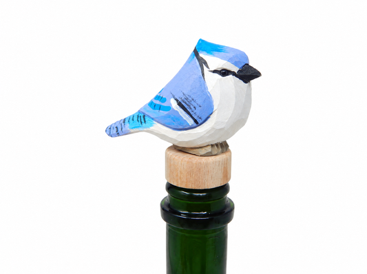 Blue Jay hand-carved wooden wine stopper by Selsela, on a plain background