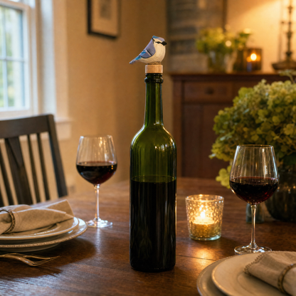 Blue Jay hand-carved wooden wine stopper by Selsela, in a styled scene