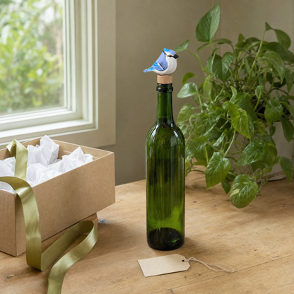 Blue Jay hand-carved wooden wine stopper by Selsela, in a styled scene