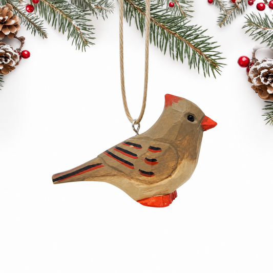 Cardinal Female hand-carved wooden ornament by Selsela, on a plain background