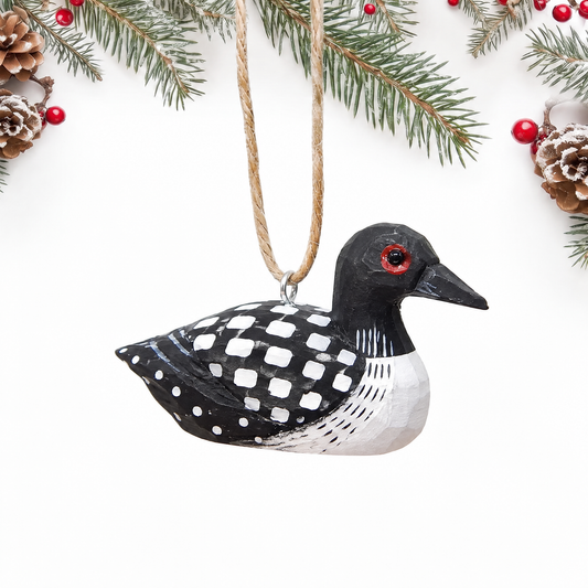 Common Loon hand-carved wooden ornament by Selsela, on a plain background