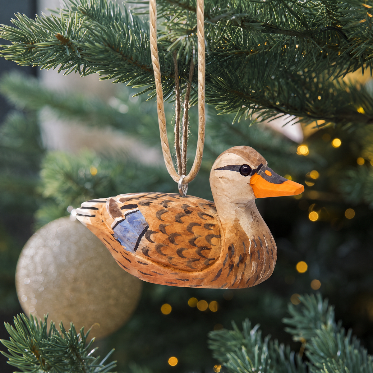 Mallard Duck Female hand-carved wooden ornament by Selsela, hanging on a Christmas tree