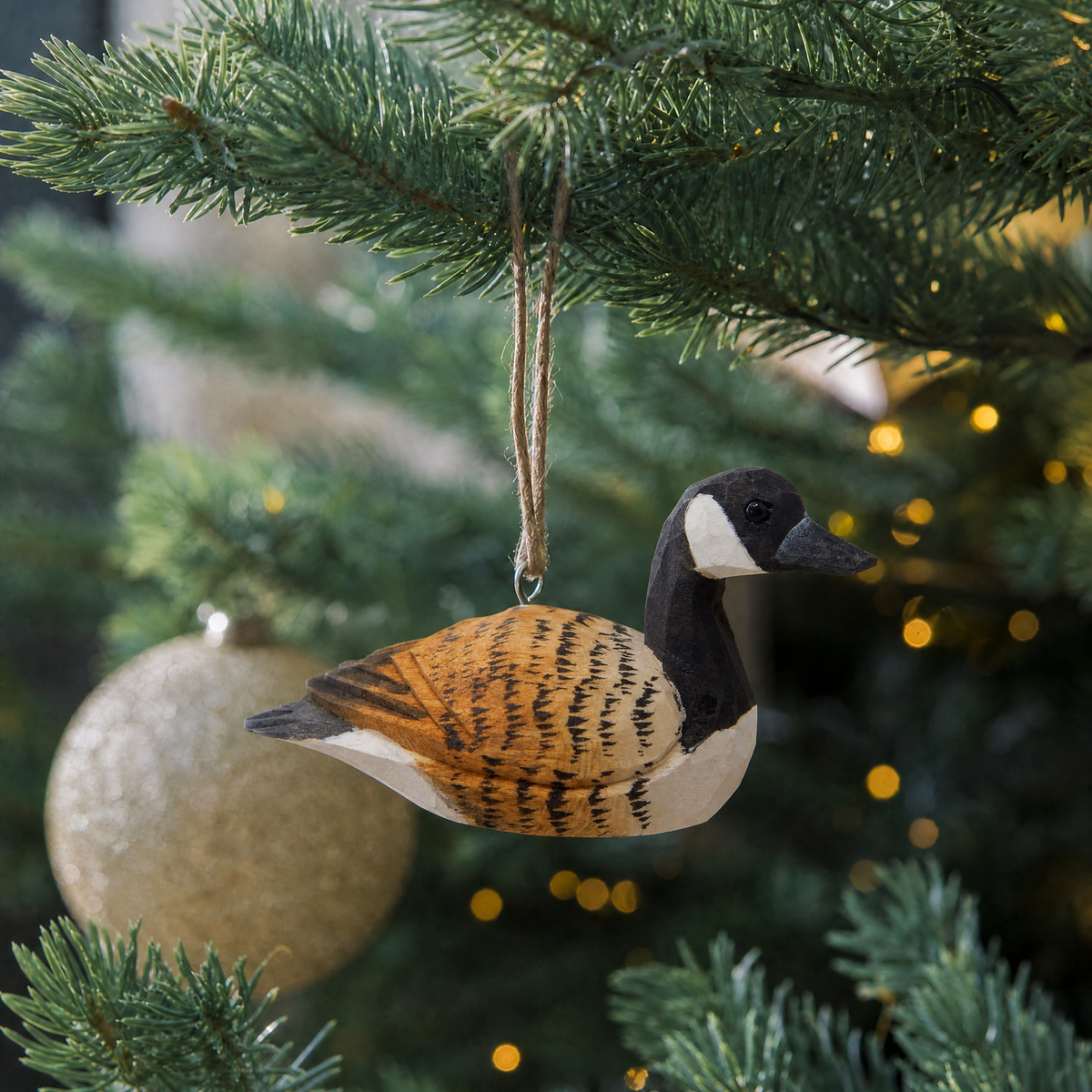 Canada Goose hand-carved wooden ornament by Selsela, hanging on a Christmas tree